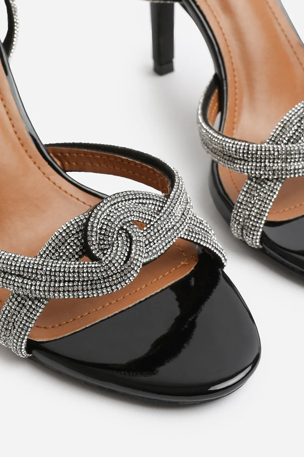 MADON DIAMANTE KNOT DETAIL WITH CROSS OVER ANKLE STRAP HIGH HEELS IN BLACK PATENT